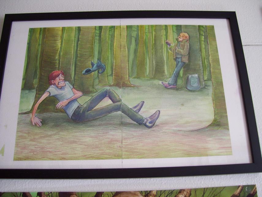 A big watercolor illustration, framed on my wall, showing Raige, a gangly redhaired white boy, freaking out in a green Forest while M.D. leans against a tree, looking completely unconcerned. Aqua, a Pokemon-like blue shapeshifter flies above Raige's head, desperate to make a good impression, but he is not succeeding.